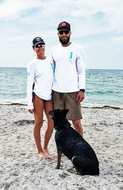 Couple on beach with DaBeach logo tees on